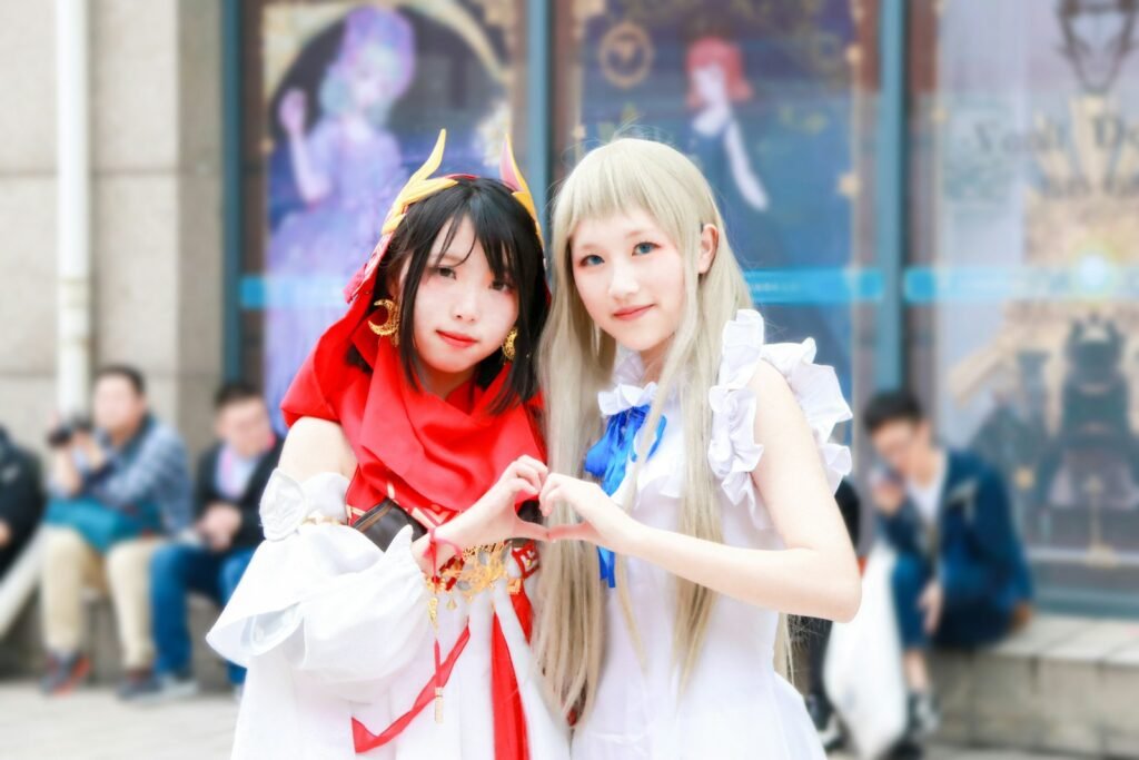 Two cosplayers in white dresses