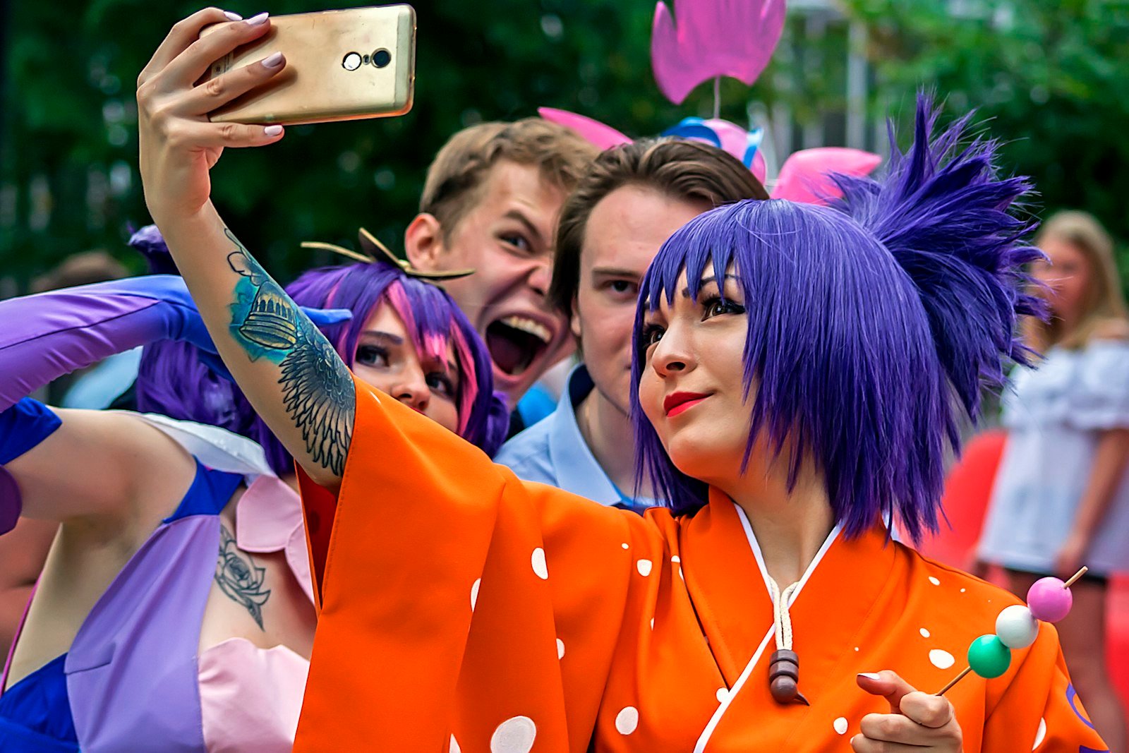 Cosplayer with purple hair at a comic convention