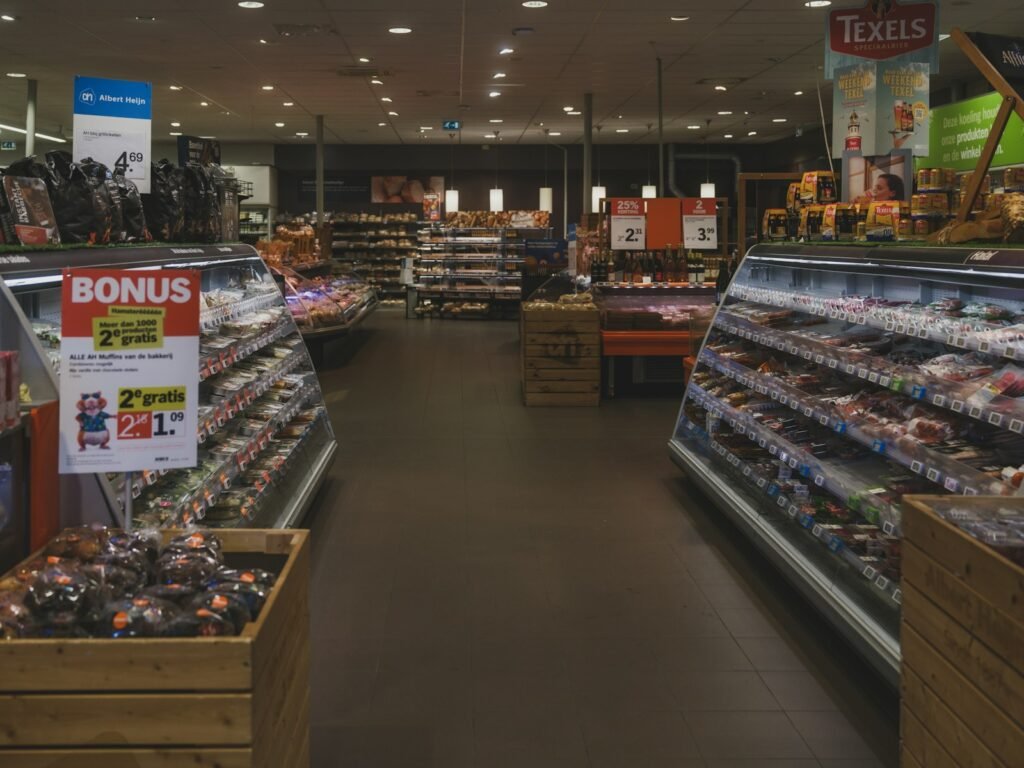 A supermarket aisle with refrigerated food displays