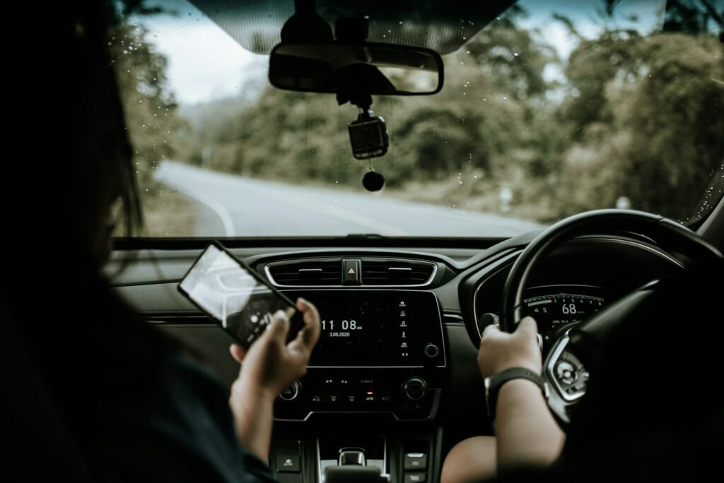 Hands on the steering wheel while driving a car