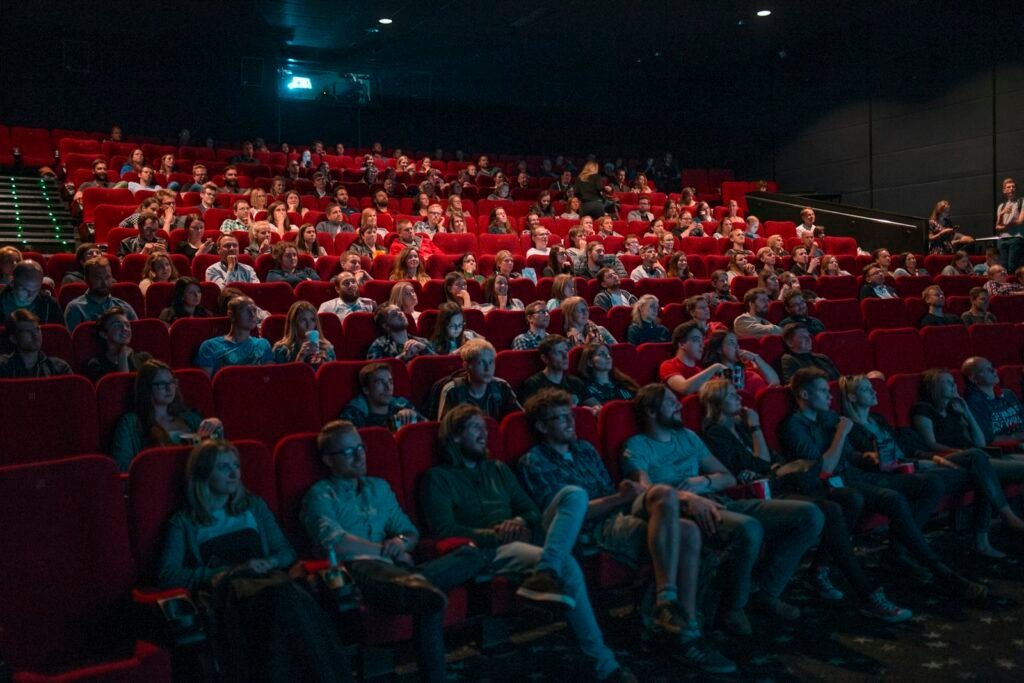 Person watching a film in a cinema