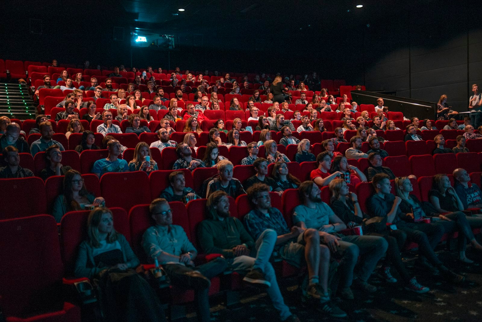 Person watching a film in a cinema