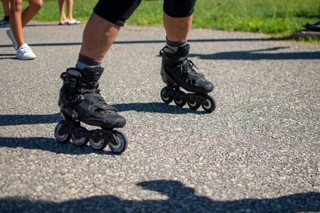 Close-up of inline skates rolling on the street during a group skate