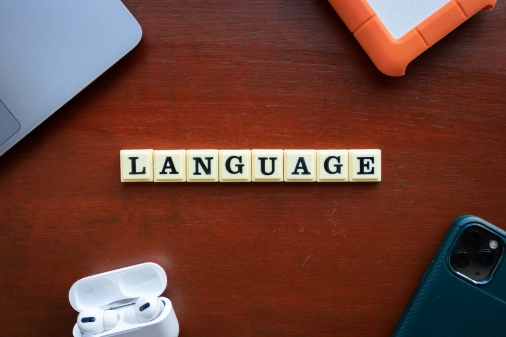 Scrabble tiles spelling the word language on a table