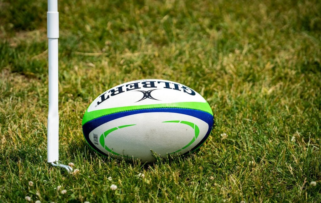 Rugby ball on a green rugby field