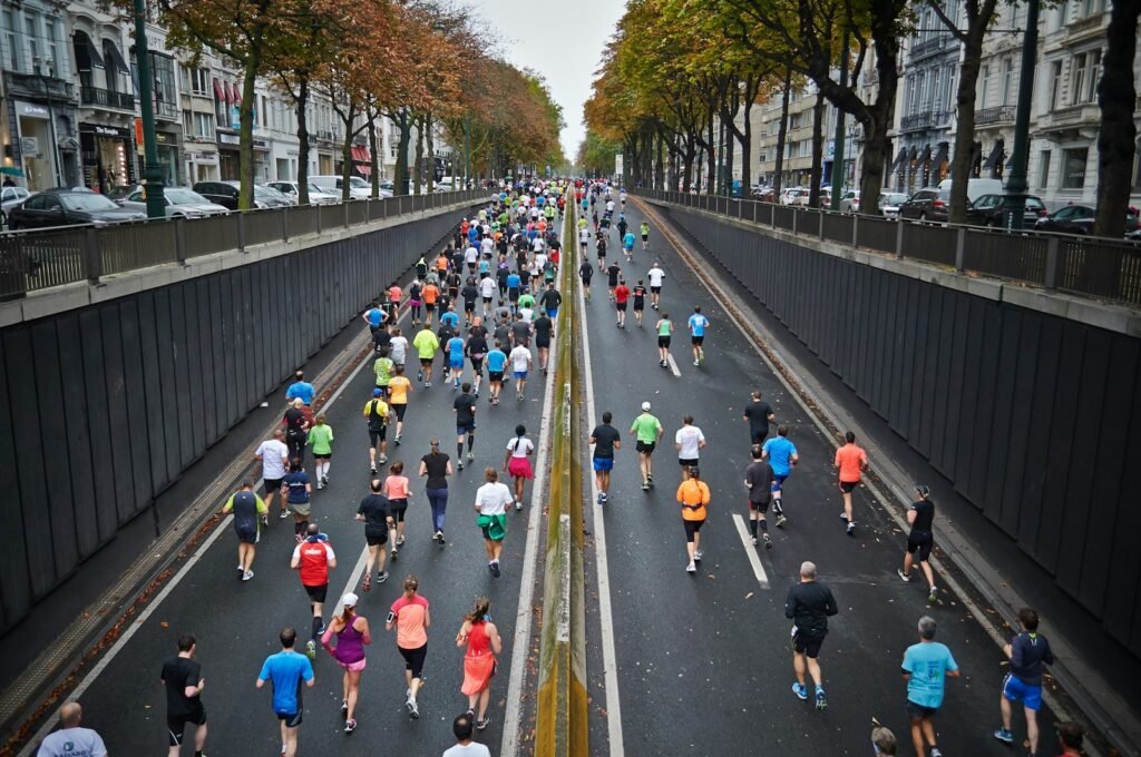 A large group of runners on a road during a running event