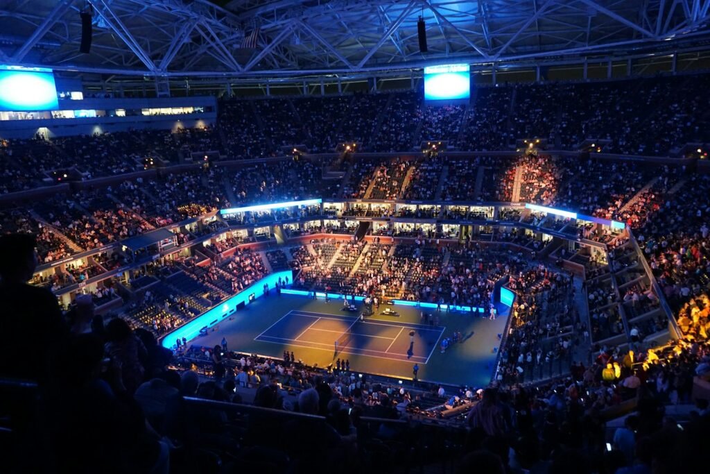 Spectators in a tennis stadium