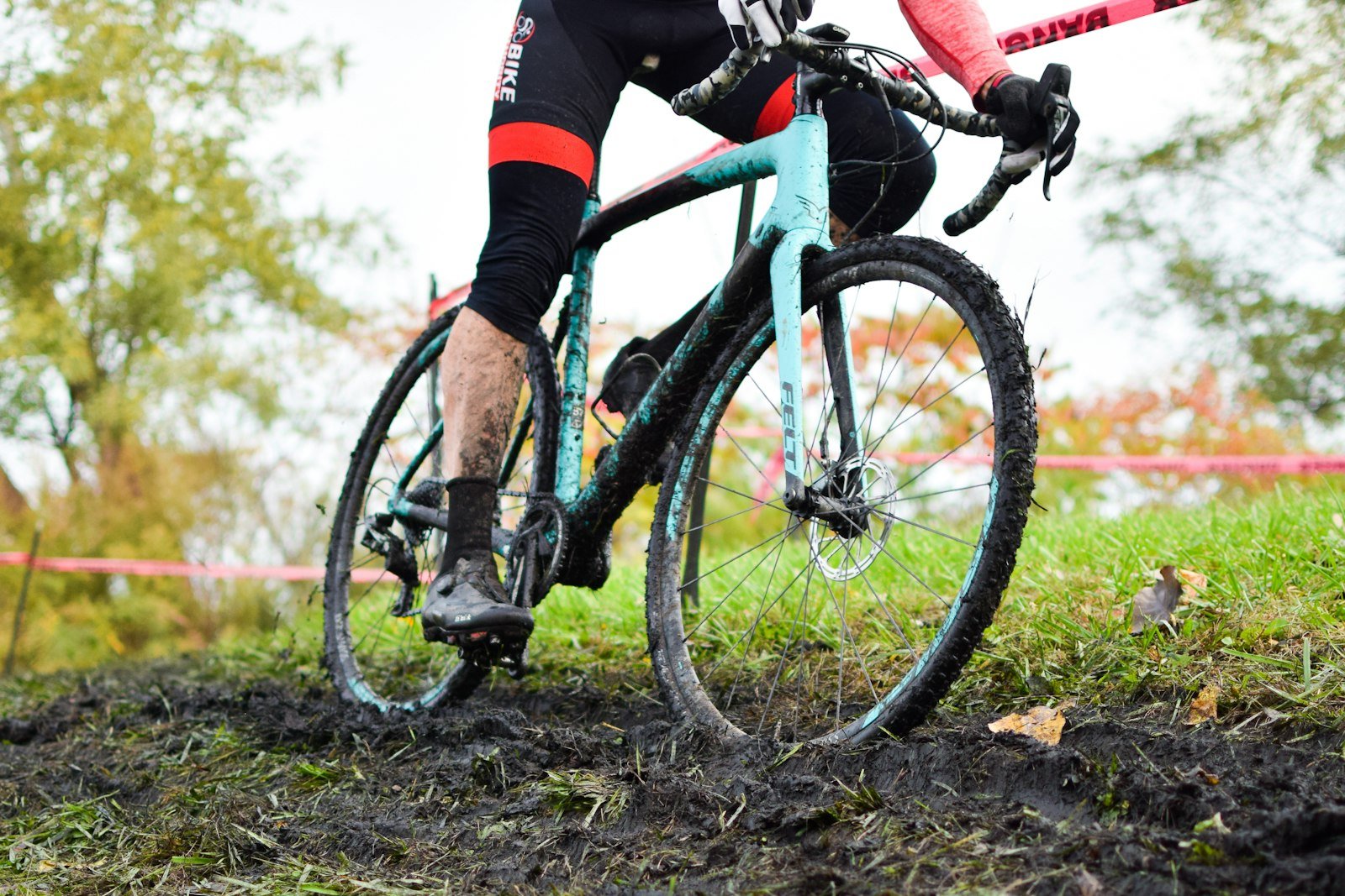 Cyclist on a muddy trail