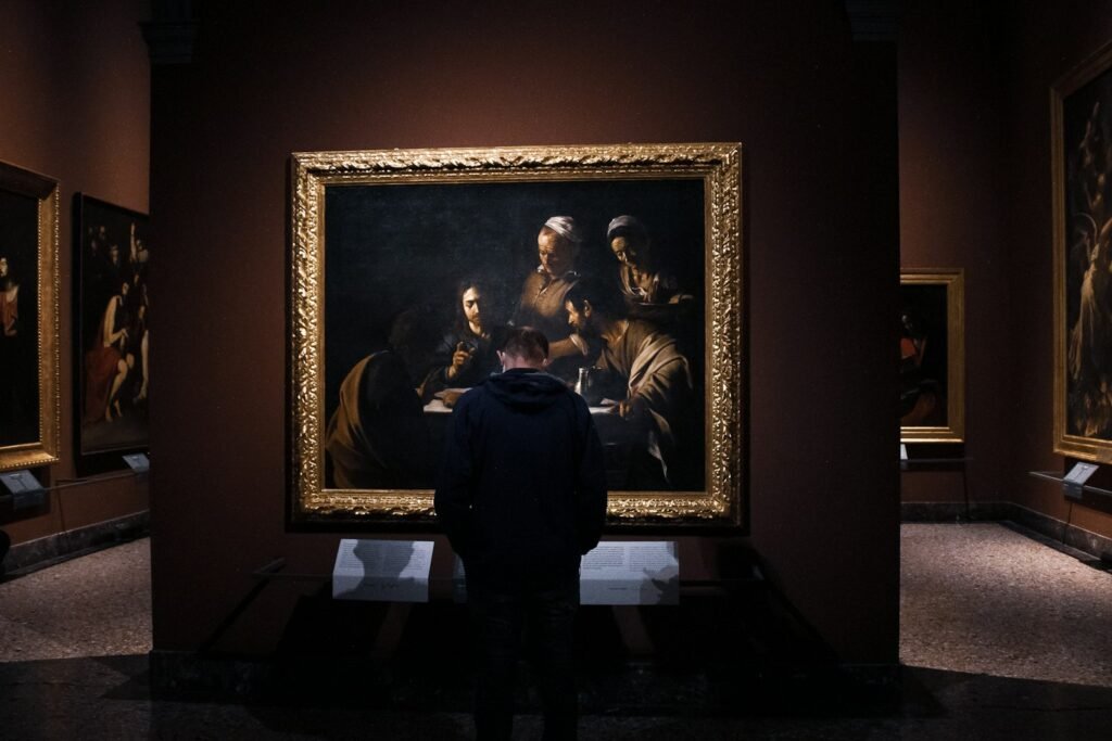 Visitor looking at a painting in a museum