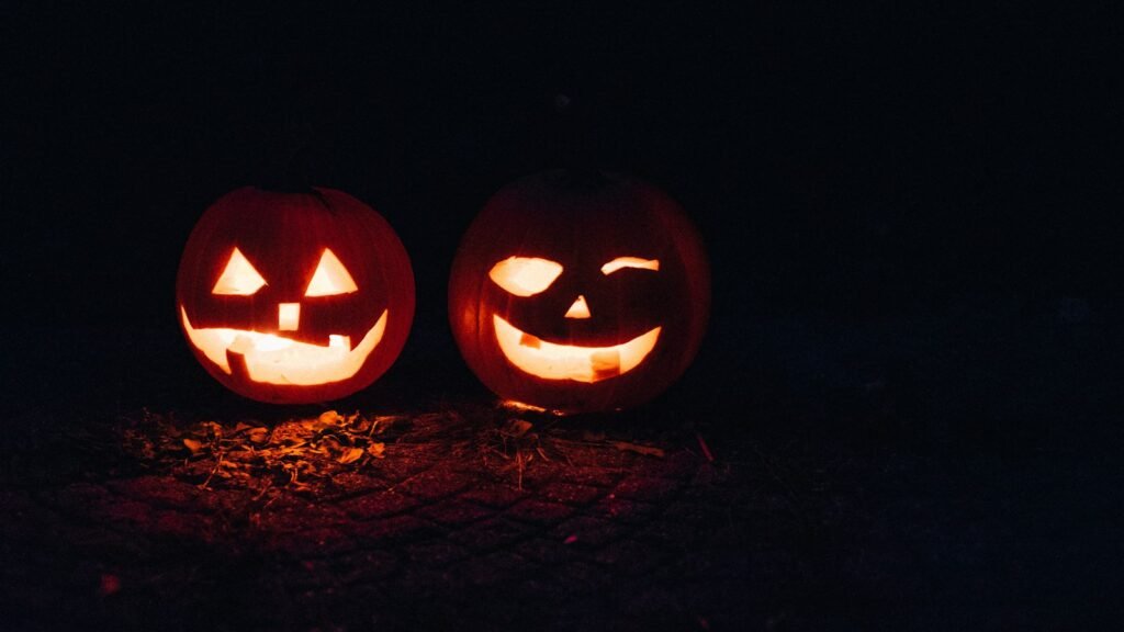 Lit jack-o-lanterns at night