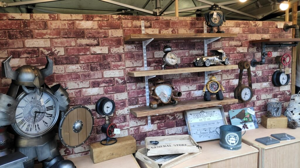 Antique clocks and decor on wooden shelves