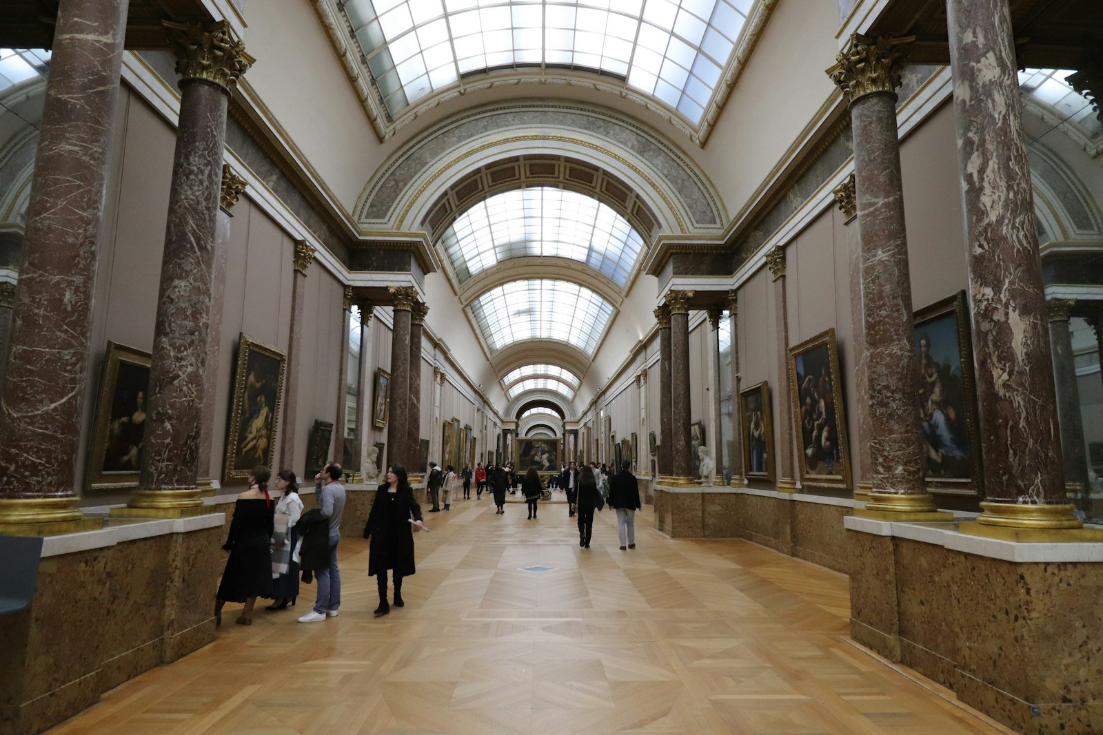 People walking through an art museum gallery