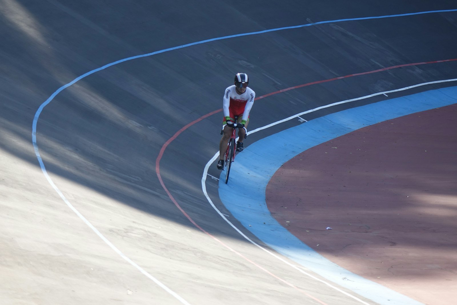 Cyclist racing on a velodrome track