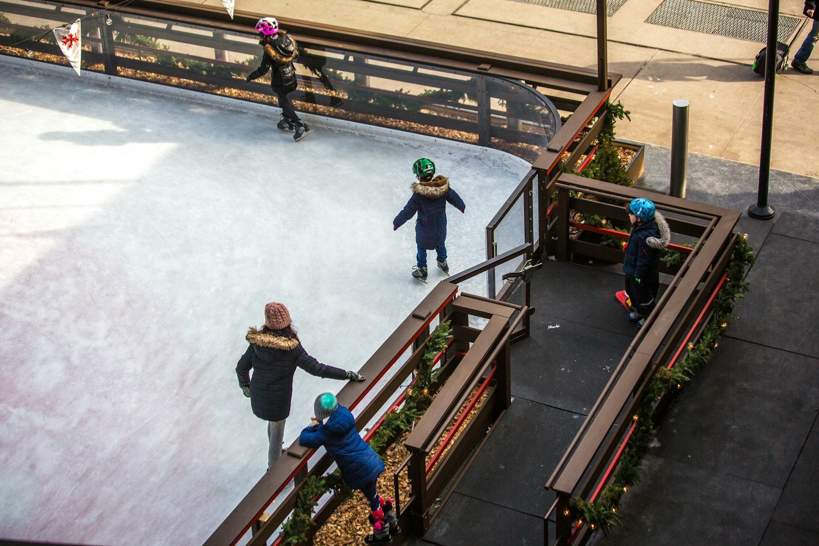 Children skating on an ice rink