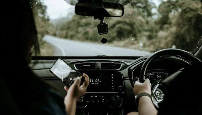 Hands on the steering wheel while driving a car