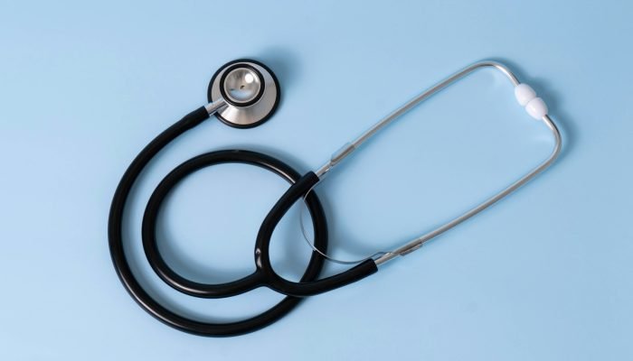 Medical stethoscope on a light blue background