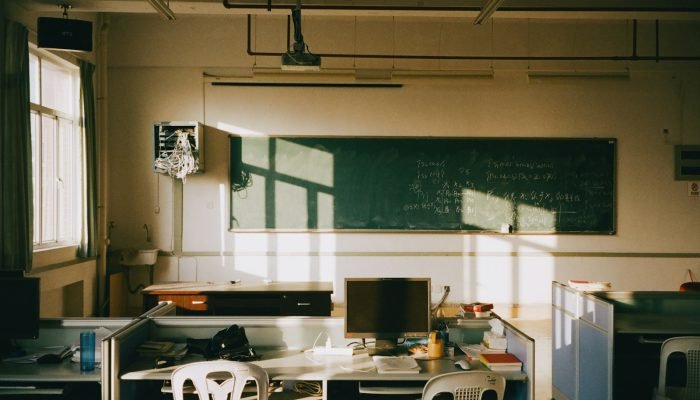 Sunlight streaming into an empty classroom