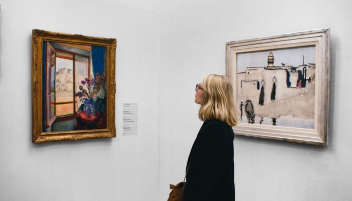 Woman looking at a painting