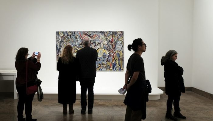 People in front of a painting